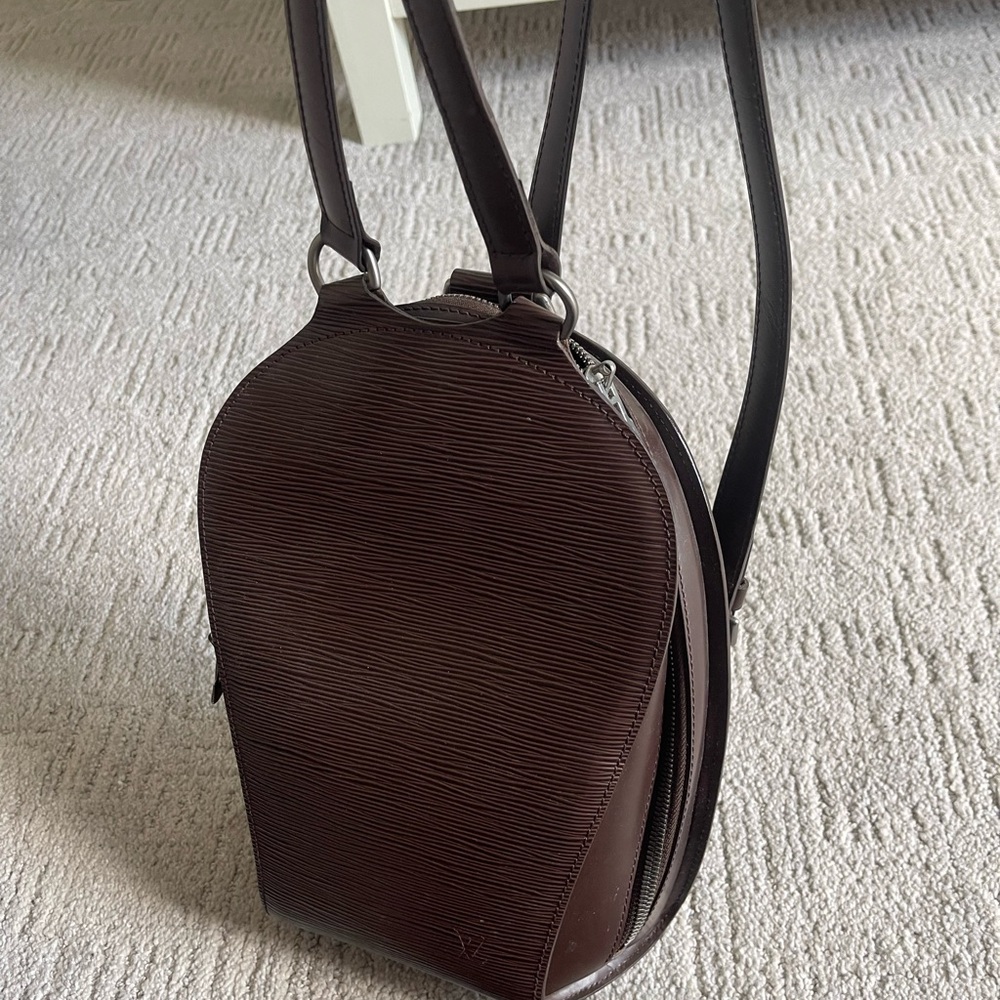 Brown LV backpack with silver finishes